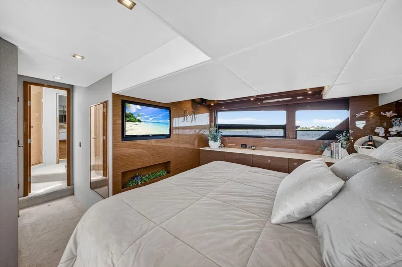 Slide: The Image of Luxurious bedroom interior of 2020 Cruisers Yachts 50 Cantius with modern decor and scenic views. - 52