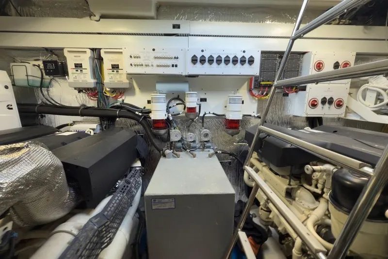 Slide: The Image of Engine room of 2020 Cruisers Yachts 50 Cantius, featuring control panels and machinery. - 68