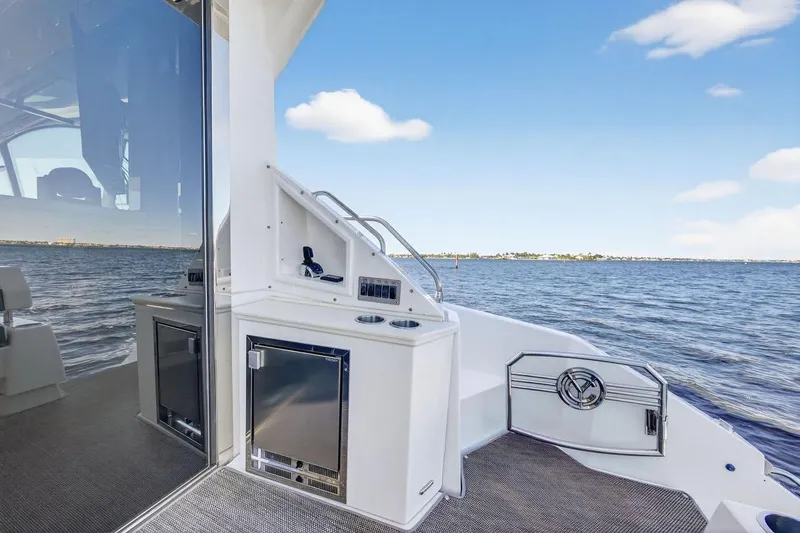 Slide: The Image of 2020 Cruisers Yachts 50 Cantius deck with ocean view and sleek design. - 16