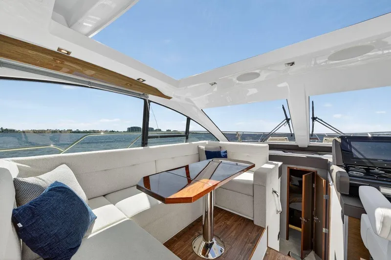 Slide: The Image of Luxurious interior of 2020 Cruisers Yachts 50 Cantius with elegant seating and panoramic views. - 25