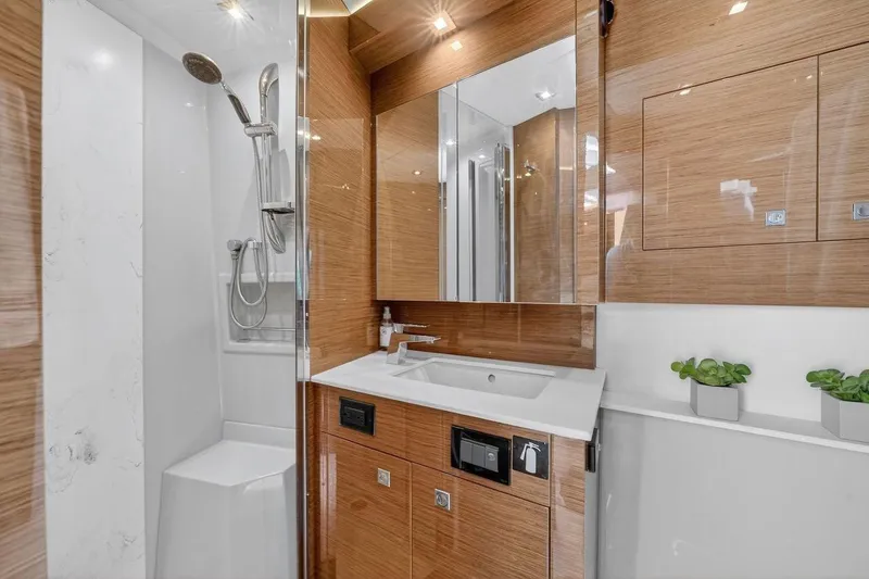 Slide: The Image of Luxurious bathroom in 2020 Cruisers Yachts 50 Cantius with modern fixtures and wood accents. - 38
