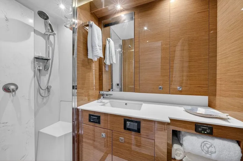 Slide: The Image of Luxurious bathroom in 2020 Cruisers Yachts 50 Cantius with modern fixtures and wood accents. - 46