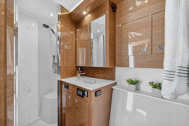 Slide: The Image of Luxurious bathroom in 2020 Cruisers Yachts 50 Cantius, featuring modern fixtures and elegant wood finishes. - 47