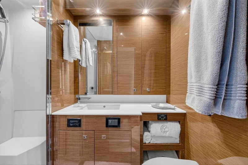 Slide: The Image of Luxurious bathroom in 2020 Cruisers Yachts 50 Cantius, featuring modern fixtures and elegant wood finishes. - 49