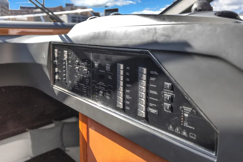Slide: The Image of Control panel of a 2013 Princess V57 yacht, featuring various switches and indicators. - 11