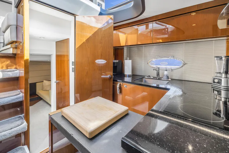Slide: The Image of Luxurious 2013 Princess V57 yacht kitchen with modern amenities and sleek design. - 14