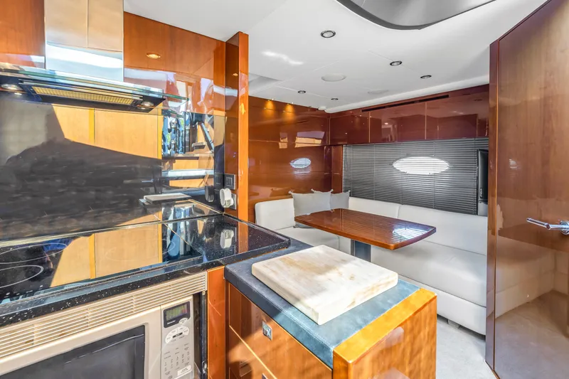 Slide: The Image of Luxurious interior of 2013 Princess V57 yacht with modern kitchen and dining area. - 16