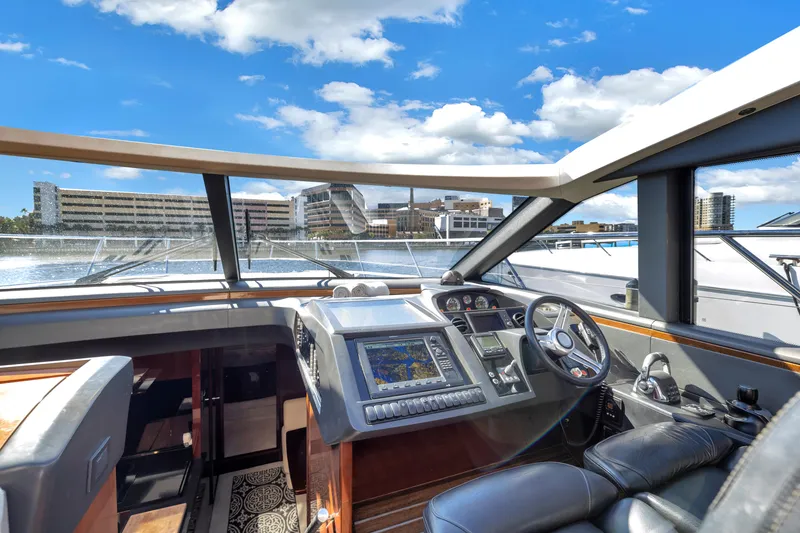 Slide: The Image of Luxurious 2013 Princess V57 yacht cockpit with modern navigation system and panoramic views. - 22