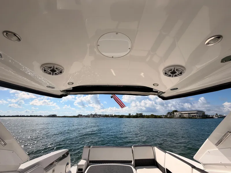 Slide: The Image of View from a 2017 Monterey 378 Super Express boat, overlooking serene waters and a clear sky. - 12
