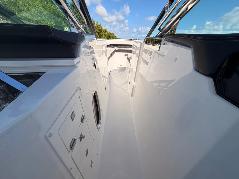 Slide: The Image of 2017 Monterey 378 Super Express boat deck with sleek design and clear blue sky. - 14