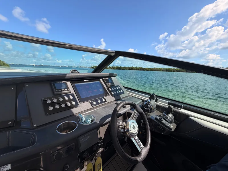 Slide: The Image of Cockpit view of 2017 Monterey 378 Super Express boat on a sunny day. - 15