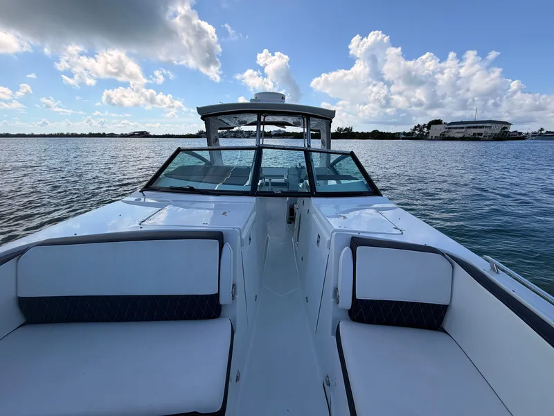Slide: The Image of 2017 Monterey 378 Super Express boat on calm water under a partly cloudy sky. - 18