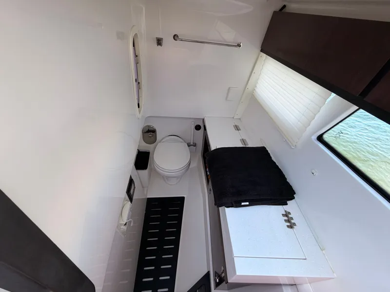 Slide: The Image of Bathroom interior of 2017 Monterey 378 Super Express yacht, featuring modern fixtures and window view. - 20