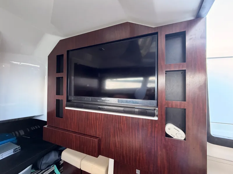 Slide: The Image of Interior of 2017 Monterey 378 Super Express with built-in TV and wood paneling. - 22