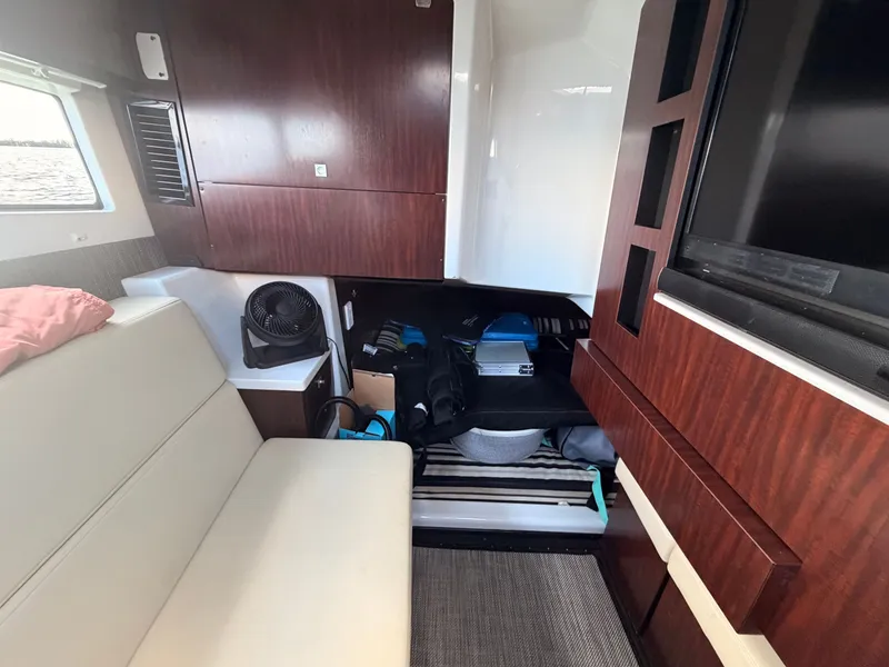 Slide: The Image of Interior of 2017 Monterey 378 Super Express yacht with seating and storage area. - 23