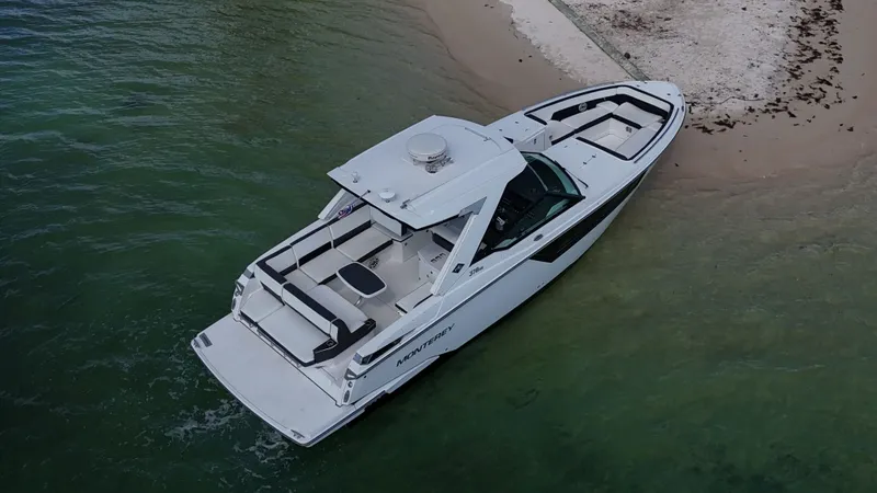 Slide: The Image of Aerial view of 2017 Monterey 378 Super Express yacht docked on sandy shore. - 4