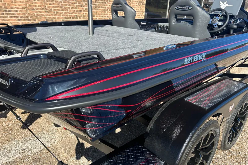 Slide: The Image of 2026 Phoenix 921 Elite X boat with sleek design and red accents. - 3