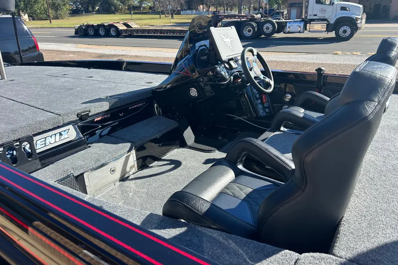 Slide: The Image of Interior of 2026 Phoenix 921 Elite X boat with steering console and seating. - 5