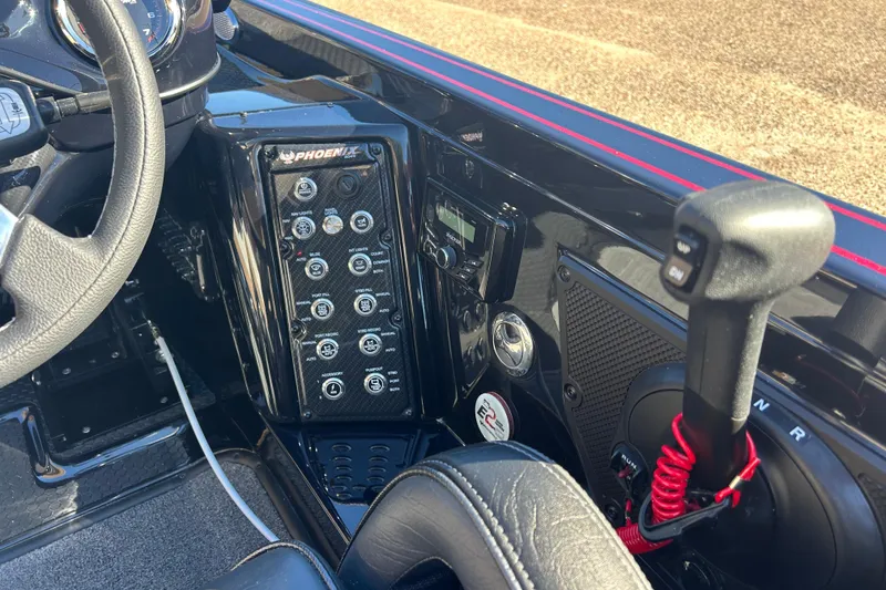 Slide: The Image of Interior of 2026 Phoenix 921 Elite X boat with control panel and steering wheel. - 6