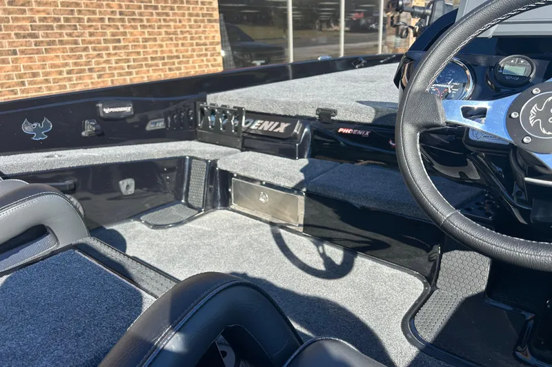 Slide: The Image of Interior of 2026 Phoenix 921 Elite X boat with steering wheel and dashboard. - 7