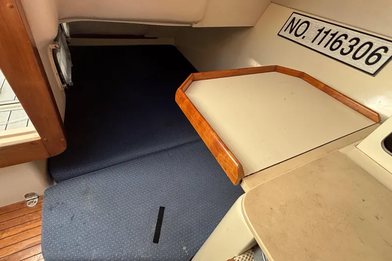 Slide: The Image of 2001 Albin 28 Tournament Express cabin interior with bed and wooden trim. - 18