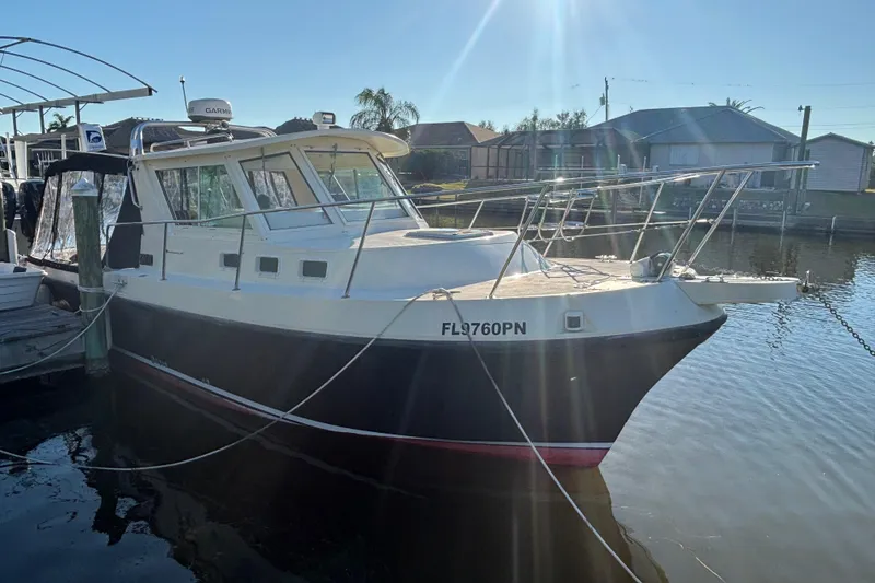 Slide: The Image of 2001 Albin 28 Tournament Express boat docked in sunny marina. - 2