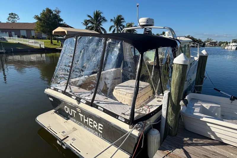 Slide: The Image of 2001 Albin 28 Tournament Express docked, featuring clear canopy and Garmin radar. - 4
