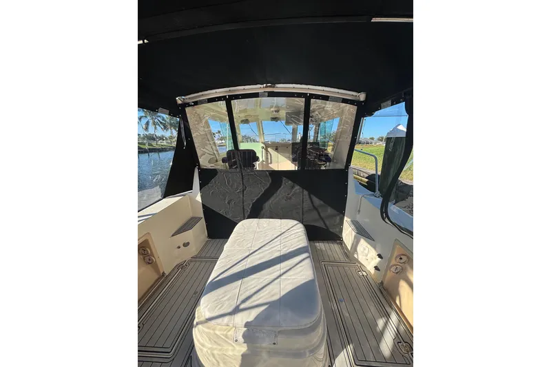 Slide: The Image of 2001 Albin 28 Tournament Express boat interior with seating and windows. - 5