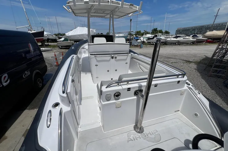 Slide: The Image of Airship 330 boat interior, 2015 model, docked with other vessels in a marina. - 14