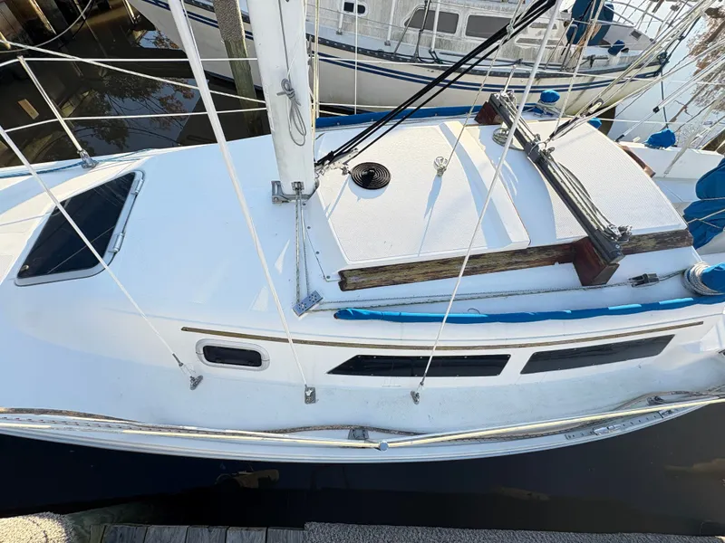 Slide: The Image of 1988 Catalina 27 sailboat docked in harbor. - 14