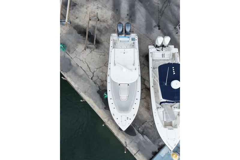 Slide: The Image of Aerial view of 2021 Sea Hunt Gamefish 30 Coffin Box docked beside another boat. - 24