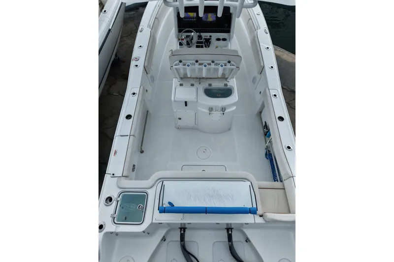 Slide: The Image of 2021 Sea Hunt Gamefish 30 Coffin Box boat interior, featuring spacious deck and modern controls. - 27