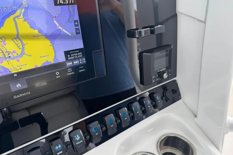 Slide: The Image of 2021 Sea Hunt Gamefish 30 dashboard with Garmin GPS and JL Audio system. - 32