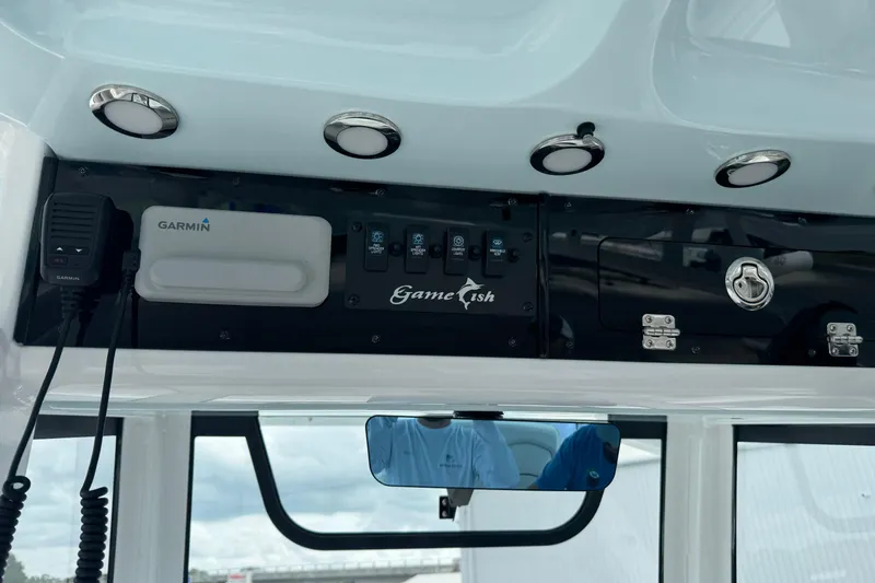 Slide: The Image of 2021 Sea Hunt Gamefish 30 Coffin Box dashboard with Garmin equipment and control panel. - 34