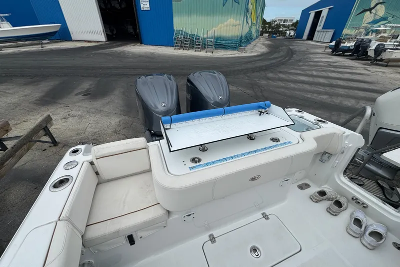 Slide: The Image of 2021 Sea Hunt Gamefish 30 Coffin Box boat with dual engines at a marina. - 36