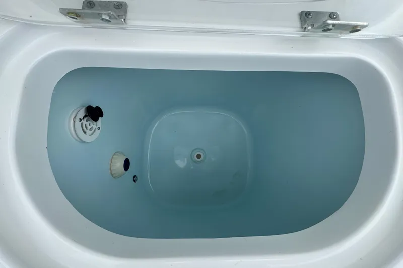 Slide: The Image of 2021 Sea Hunt Gamefish 30 Coffin Box interior with water, showcasing design and functionality. - 38