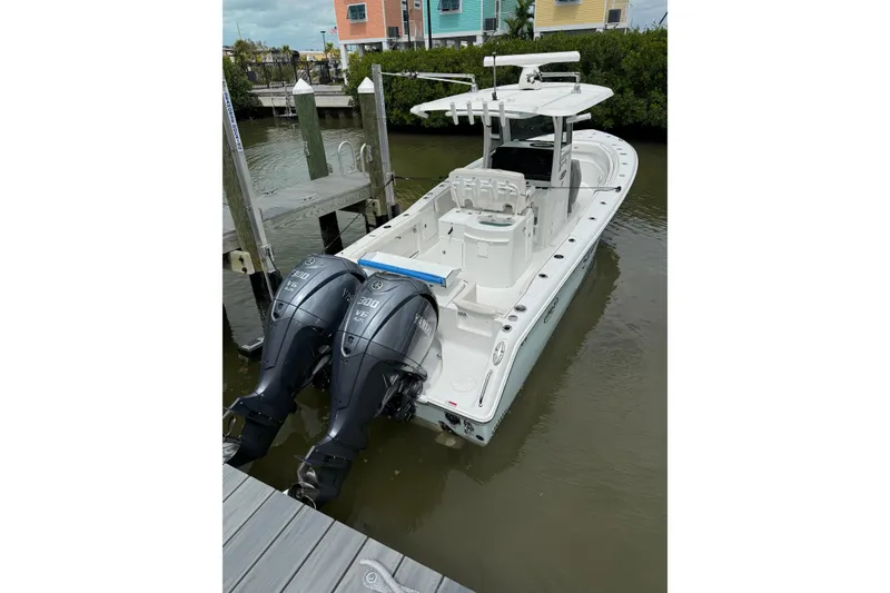 Slide: The Image of 2021 Sea Hunt Gamefish 30 Coffin Box boat with dual Yamaha 300 engines at dock. - 6