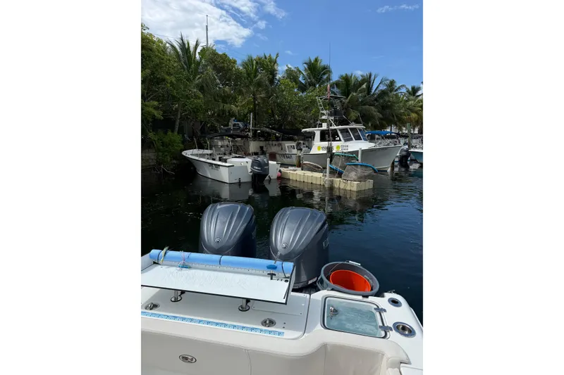 Slide: The Image of 2021 Sea Hunt Gamefish 30 Coffin Box boat docked, aerial view. - 8