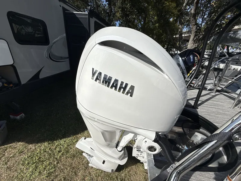 Slide: The Image of Interior view of 2026 Godfrey 255 SFL boat with black canopy. - 12