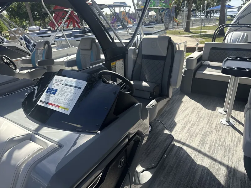 Slide: The Image of Godfrey 255 SFL 2026 pontoon boat in showroom. - 5