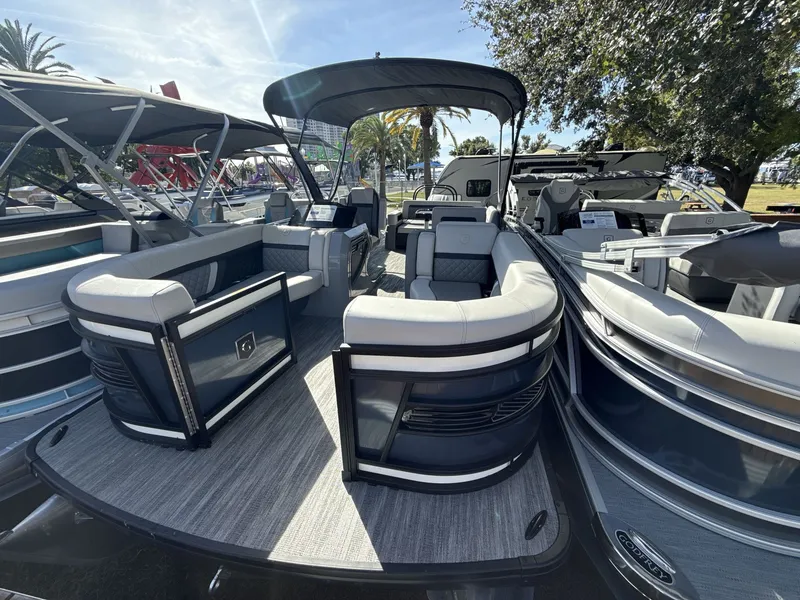 Slide: The Image of Godfrey 255 SFL 2026 pontoon boat in showroom. - 8