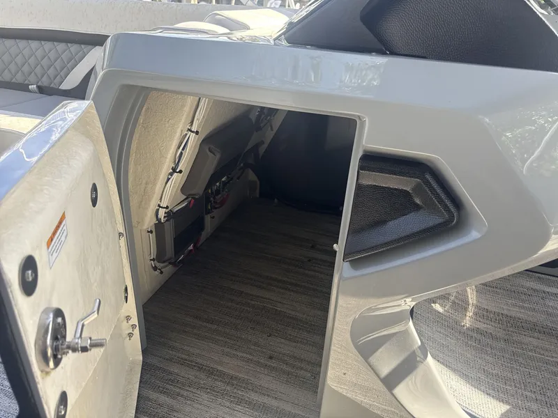 Slide: The Image of 2026 Godfrey 255 SFL pontoon boat in a showroom. - 9