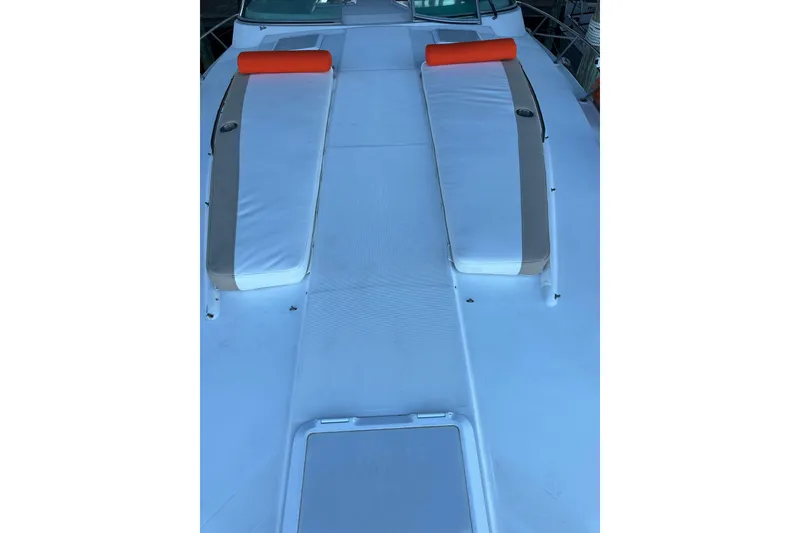 Slide: The Image of 1997 Formula 41 Performance Cruiser deck with sun pads and orange headrests. - 10