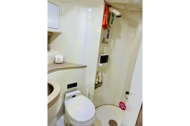 Slide: The Image of Bathroom of 1997 Formula 41 Performance Cruiser with toilet and shower amenities. - 11