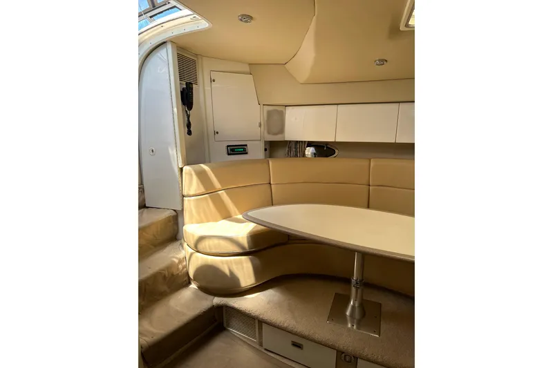 Slide: The Image of 1997 Formula 41 Performance Cruiser interior with beige seating and table. - 12