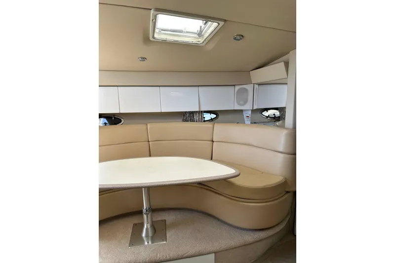 Slide: The Image of Interior of 1997 Formula 41 Performance Cruiser with beige seating and white cabinetry. - 13