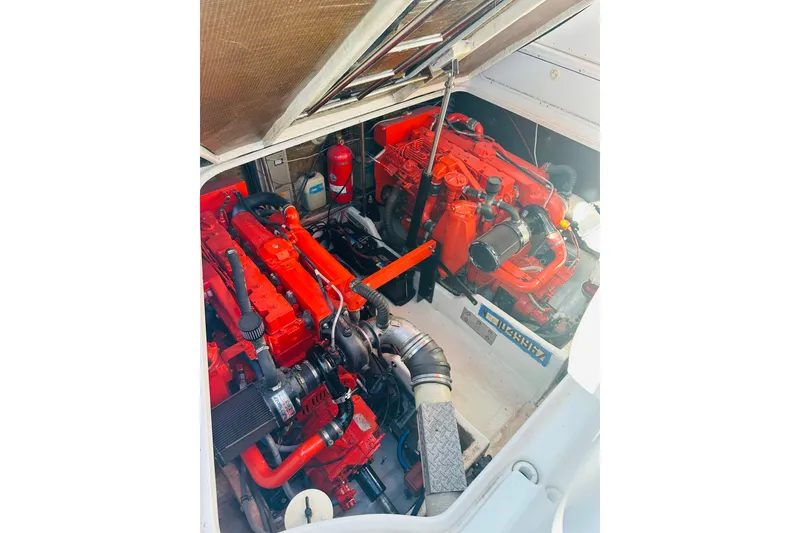 Slide: The Image of Engine compartment of a 1997 Formula 41 Performance Cruiser with vibrant red components. - 25