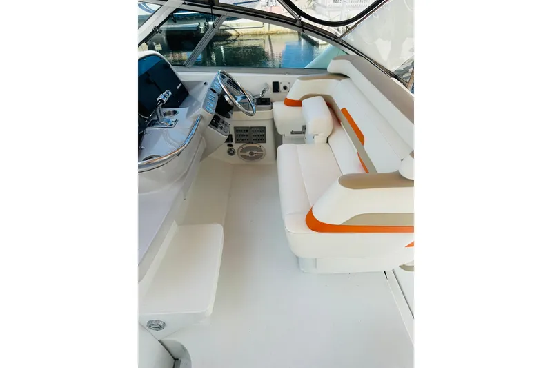 Slide: The Image of 1997 Formula 41 Performance Cruiser cockpit with white and orange seating, sleek design. - 6