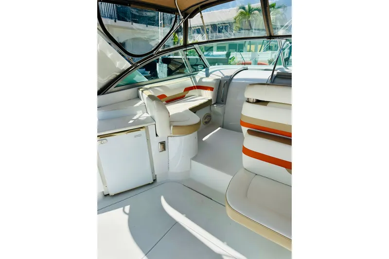 Slide: The Image of 1997 Formula 41 Performance Cruiser interior with white and orange seating. - 7