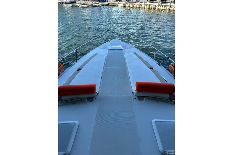 Slide: The Image of 1997 Formula 41 Performance Cruiser on water, featuring sleek deck design and vibrant orange cushions. - 9
